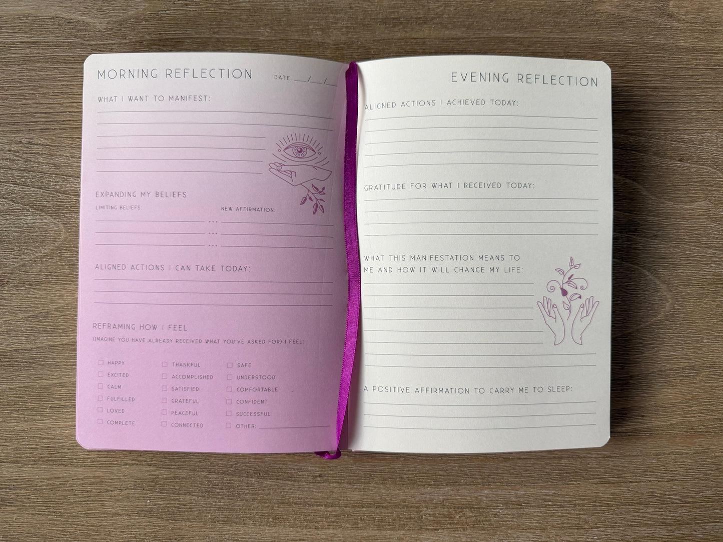 Open journal with 'Morning Reflection' and 'Evening Reflection' pages on a wooden surface