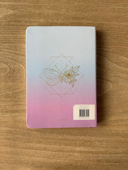 Notebook with a geometric design on a wooden surface