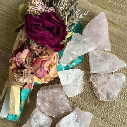 Decorative arrangement with flowers and crystals on a wooden surface